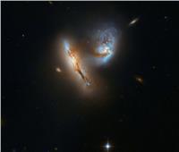 تلسكوب يلتقط صورة فوتوجرافية لاندماج مجرتين