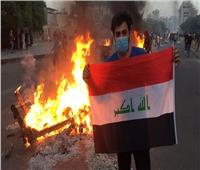 محتجون عراقيون يضرمون النار في مكاتب حزب سياسي 