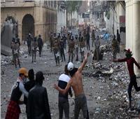 إصابة 25 متظاهرا وشرطيا في مواجهات بينهما بمدينة الكوت العراقية