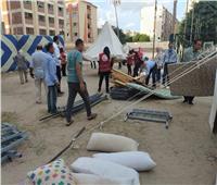 صور| مساعدات مالية ومعسكر لإيواء متضرري العقار المائل في الإسكندرية 