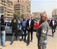 صور| نقل موقف النقل الجماعي بشارع التحرير في الدقي