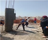 إيقاف بناء شبكة محمول أعلى مصنع ملابس شرق الإسكندرية | صور