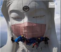 اليابان تضع كمامة تزن 35 كيلو على وجه تمثال عملاق| الفيديو