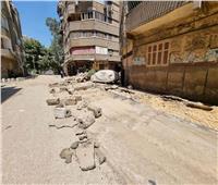 بدء أعمال الرصف والتطوير بشارع الوحدة العربية بالعمرانية| صور