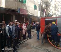 إنقاذ فتاة من حريق شقة في الإسكندرية.. والحي يوضح السبب| صور