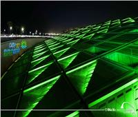 إضاءة مبني مكتبة الإسكندرية باللون الأخضر احتفالاً بانطلاق قمة المناخ.. صور