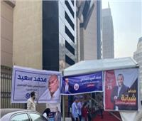 لافتات المرشحين تزين عبد الخالق ثروت.. توافد الصحفيين للمشاركة في الانتخابات