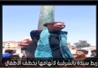 بالفيديو.. مواطنون يعلقون سيدة بعمود إنارة لمحاولتها خطف طفل